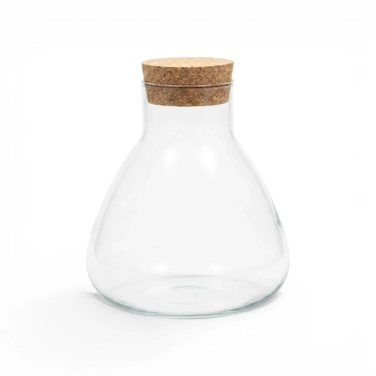 Clear glass carafe Pyramide with a cork lid on a white background