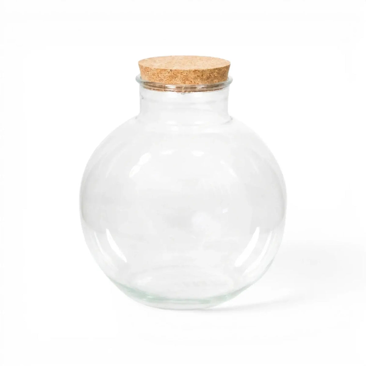 Clear glass jar  Bowl  with a cork lid on a white background