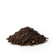 Heap of dark brown potting soil on a white background