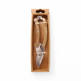 Stainless steel pruner on white background.