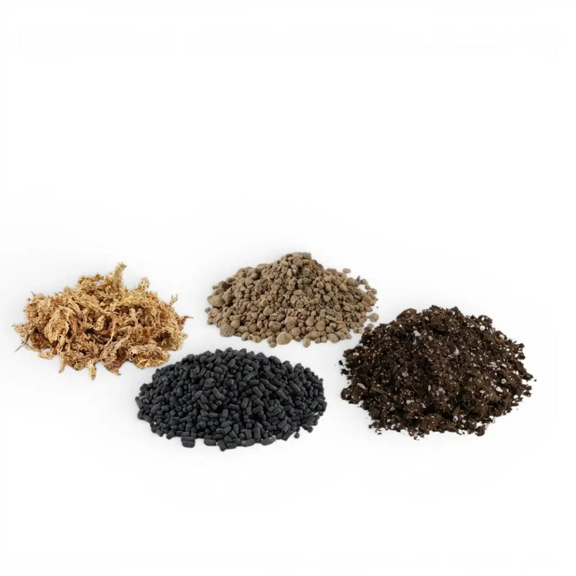 Terrarium substrate mix ingredients: soil, lava granules, sphagnum moss and activated carbon pellets on white backround